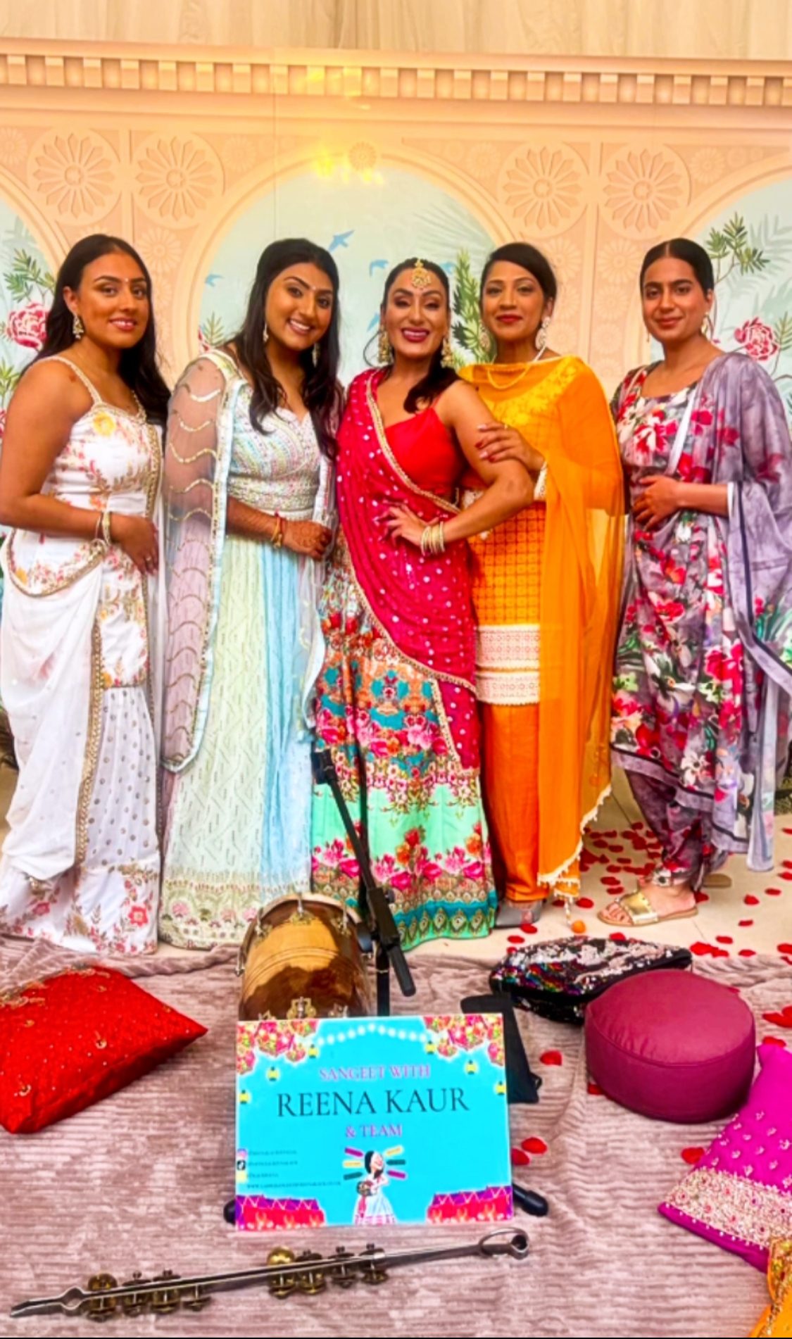 Reena Kaur and her Ladies Sangeet team beside a dholki before a performance