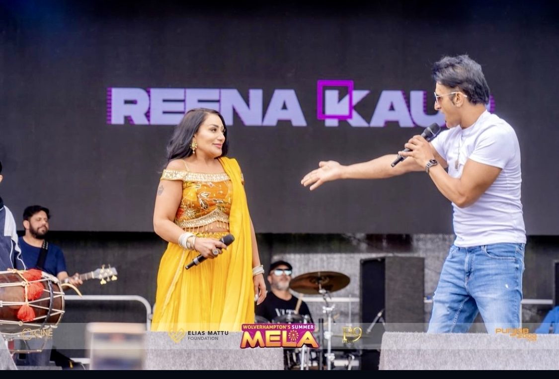 Reena Kaur performing live on stage at Wolverhampton&rsquo;s Summer Mela with her band